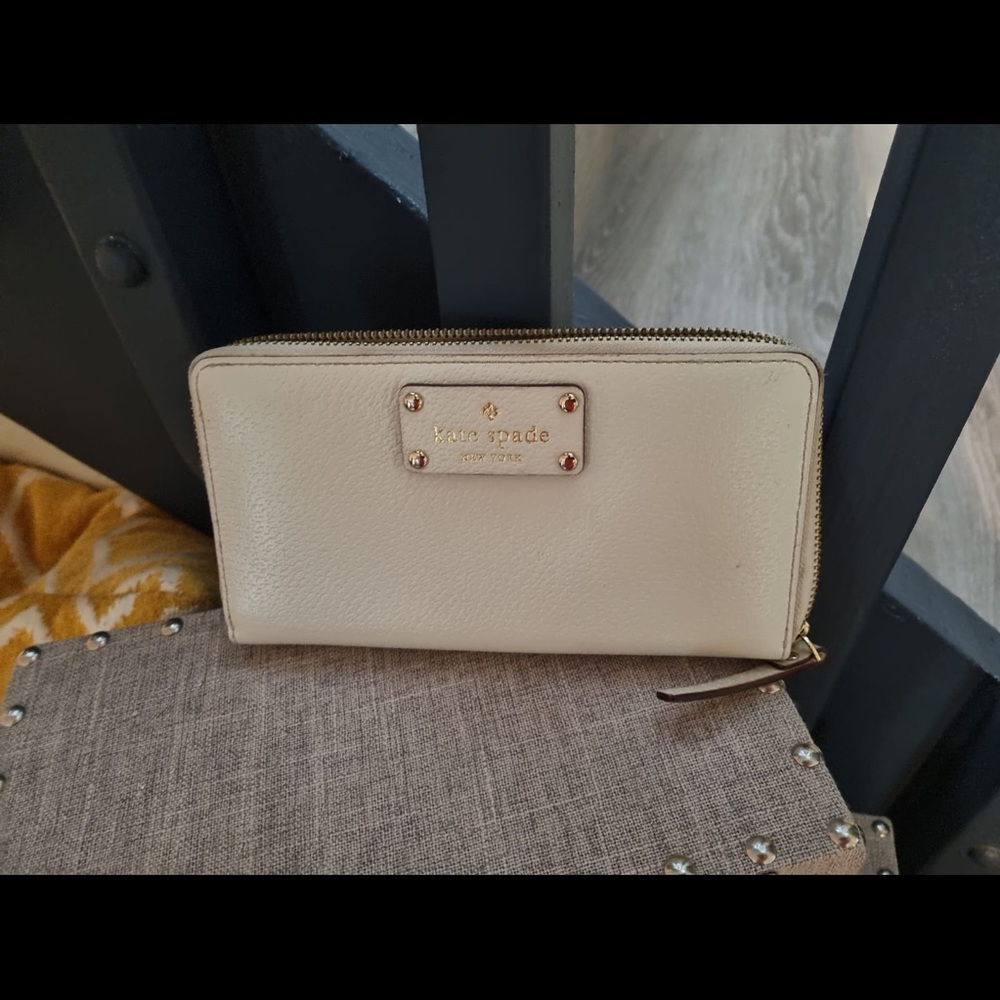 Kate Spade off white zip wallet with gold dots inside. Gently worn.